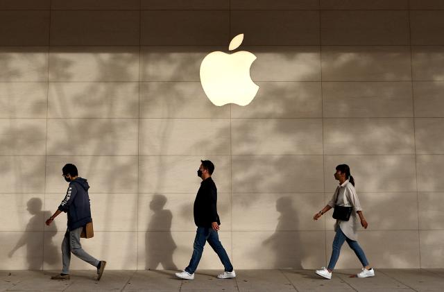 People walk pass an Apple store in Taipei, Taiwan, November 7, 2022. REUTERS/Ann Wang